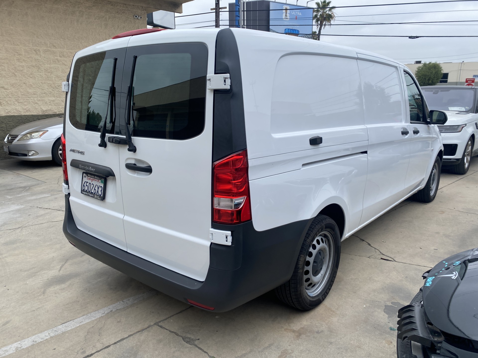 Before and after 2023 Mercedes-Benz cargo van rear repair in Los Angeles